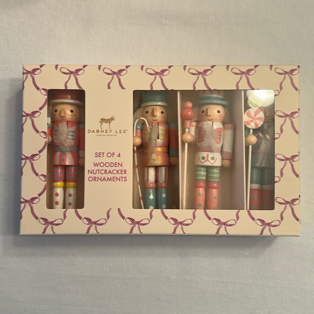 Set of 4 wooden Nutcracker Ornaments. Pastel Color Palette